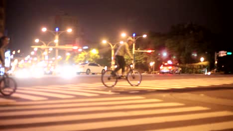 Teengers-riding-bicycles-in-group-and-jumping-with-bike