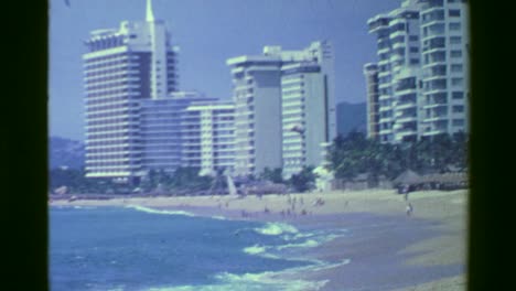 1978:-High-rise-resort-hotels-facing-popular-tourism-crashing-wave-beach.