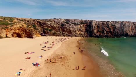 Flight-over-beautiful-sandy-beach-in-Portugal,-Praia-do-Beliche,-Sagres,-aerial-view