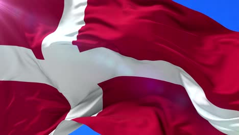 Flag-of-the-Kingdom-of-Denmark-waving-at-wind-with-blue-sky,-loop