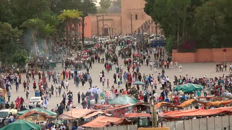 Crowds-of-pedestrians-walking-in-old-town-Medina-in-Marrakesh,-Morocco.