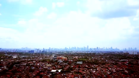 Aerial-view-of-residential-with-jakarta-skyscrapers-in-distance