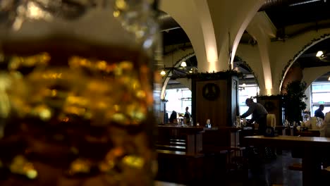 German-Beer-house,-focus-pull-on-close-up-of-stein-of-beer