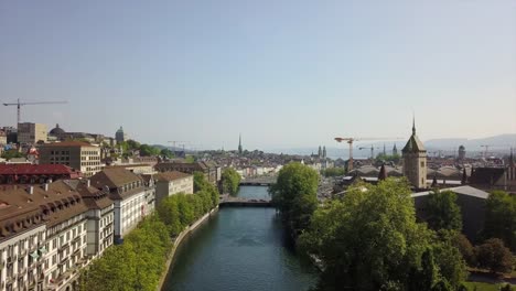 día-soleado-zurich-ciudad-centro-río-aérea-Suiza-panorama-4k