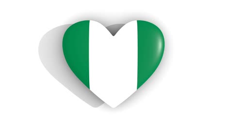 Palpitante-corazón-en-los-colores-de-la-bandera-de-Nigeria,-sobre-un-fondo-blanco,-top-de-renderizado-3d,-lazo