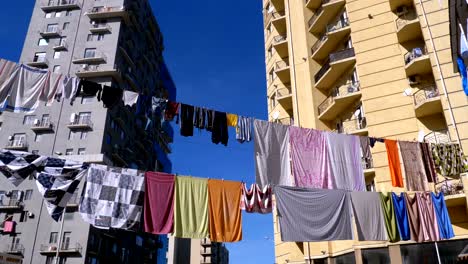 Clothes-hanging-and-drying-on-a-rope-on-a-multi-story-building-in-a-poor-district-of-the-city