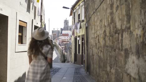 Following-girl-on-narrow-street