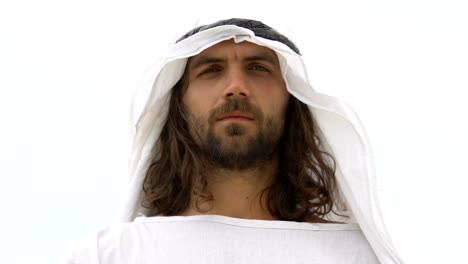 Handsome-male-arab-looking-into-camera,-wearing-keffiyeh,-traditional-clothing