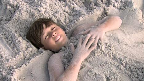 Boy-buried-in-sand