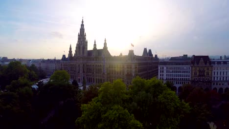 Vienna's-beautiful-aerial-shot-Rathaus,-seat-mayor-city-council.-Beautiful-aerial-shot-above-Europe,-culture-and-landscapes,-camera-pan-dolly-in-the-air.-Drone-flying-above-European-land.-Traveling-sightseeing,-tourist-views-of-Austria.