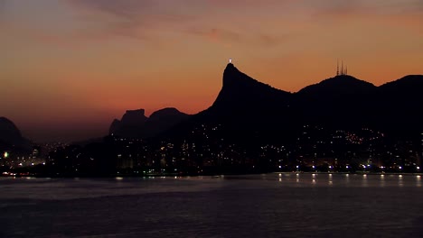 Low-angle-aerial-view-of-Rio-de-Janeiro-Corcovado-Hill-at-Dusk,-Brazil