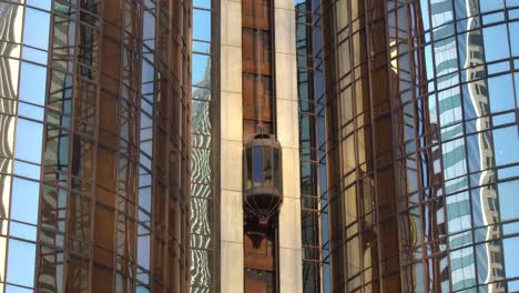 Outdoor-glass-modern-futuristic-elevator-moving-down