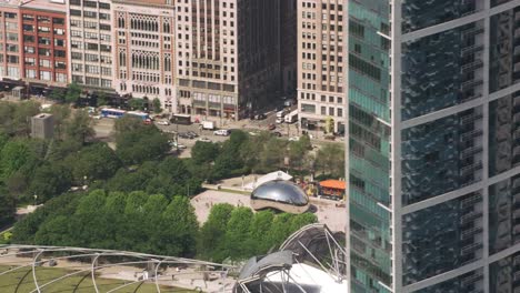 Revealing-Cloud-Gate-from-behind-downtown-Chicago-buildings.