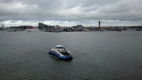 4k-Aerial-shot-orbiting-a-passenger-ferry-boat-in-Amsterdam