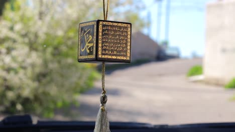 Religious-Islamic-symbol-on-the-mirror-of-the-car