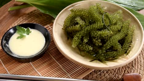 Umi-budou-Seaweed-or-Green-Caviar-Healthy-sea-food-or-sea-grapes-seaweed-on-plate,-Caulerpa-lentillifera---sea-grapes-or-green-caviar.