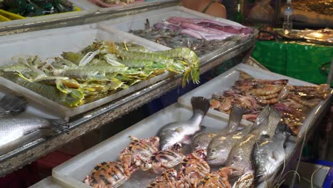 famous-night-time-phuket-island-sea-food-market-place-slow-motion-panorama-4k-thailand