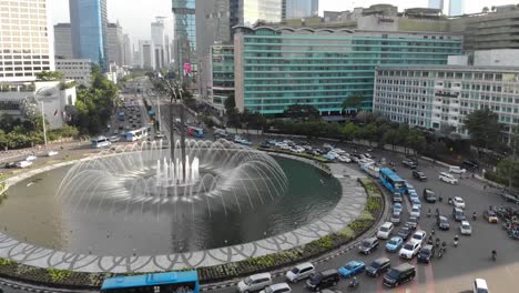 Aerial-view-clip-of-Selamat-Datang-monument-statue-or-Welcome-monument-of-Jakarta-with-road-traffic