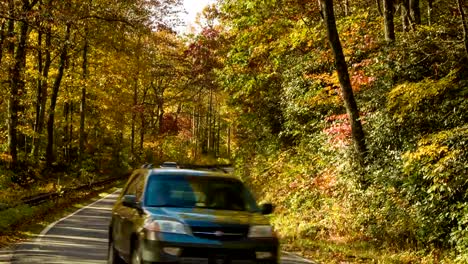 Vehicles-Driving-in-Autumn-Colored-Forest-in-North-Carolina-Mountains