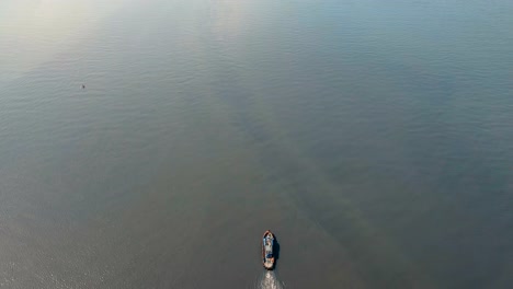 Aerial-view-tugboat-and-barge-in-the-sea.Philippines,-Manila