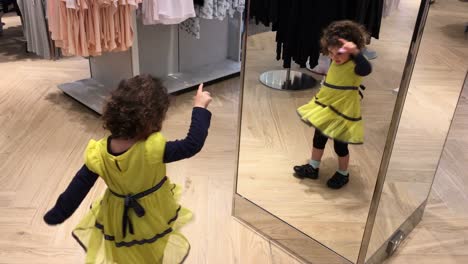 Little-girl-dancing-in-front-of-a-mirror