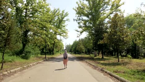 Woman-walks-in-the-park,-Tskaltubo,-Georgia