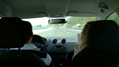 A-couple-driving-in-a-car-on-a-vacation-time-lapse