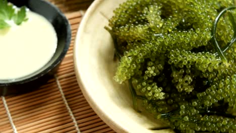 Umi-budou-Seaweed-or-Green-Caviar-Healthy-sea-food-or-sea-grapes-seaweed-on-plate,-Caulerpa-lentillifera---sea-grapes-or-green-caviar.