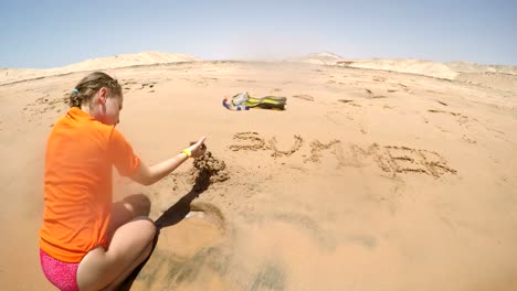 Little-girl-creating-sand-castle
