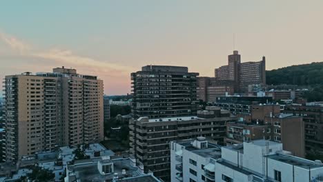 Aerial-footage-of-rundown-highrises-during-a-hazy-summer-day