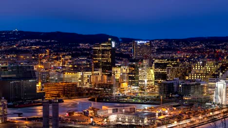 Lapso-de-tiempo-de-Noruega-Oslo-4K,-vista-aérea-ciudad-horizonte-día-a-timelapse-atardecer-noche-en-el-distrito-de-negocios-y-proyecto-de-Bercode