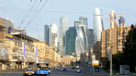 Traffic-on-morning-street-with-skyscrapers-on-background.-Moscow,-Russia.