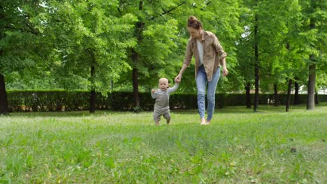 Mother-and-Crying-Baby-Walking-on-Grass