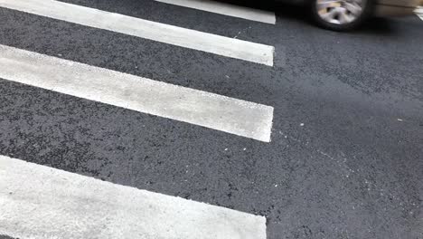 Cars-passing-by-on-crosswalk