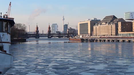 Berlin-skyline-at-iced-river-spree-in-winter