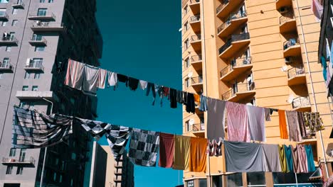 Clothes-hanging-and-drying-on-a-rope-on-a-multi-story-building-in-a-poor-district-of-the-city