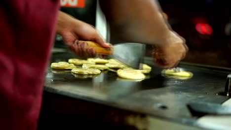 Vendor-Frying-Roti-canai/Indian-flat-bread-at-street-food-market