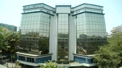 many-storied-houses-metro-train-reflects-in-glass-building-top-view-from-bridge-Mumbai