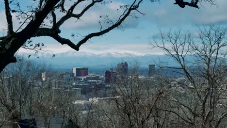 Dolly-shot-of-downtown-Asheville,-NC-during-the-winter