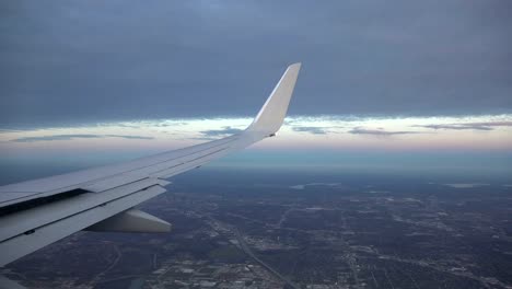 Airplane-Aerial-view-of-City-Then-Banking-Turn