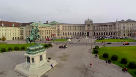 OSCE-headquarters-in-Vienna-on-Heldenplatz,-rider-statue,-aerial.-Beautiful-aerial-shot-above-Europe,-culture-and-landscapes,-camera-pan-dolly-in-the-air.-Drone-flying-above-European-land.-Traveling-sightseeing,-tourist-views-of-Austria.