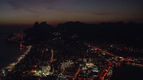 High-angle-aerial-view-of-Rio-de-Janeiro-at-night,-Brazil
