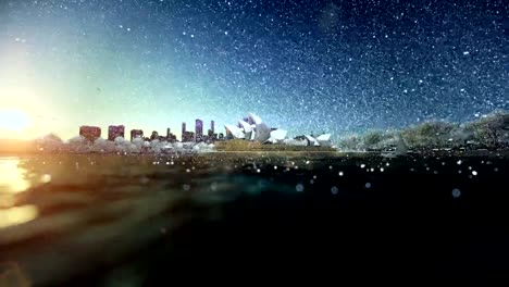 Beautiful-sunrise-over-Sydney-Opera-House,-snowing,-dolly-shot