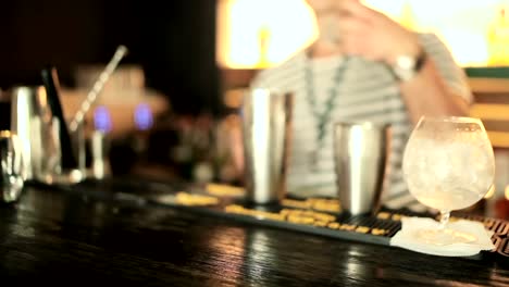 The-bartender-pours-water-from-a-shaker.