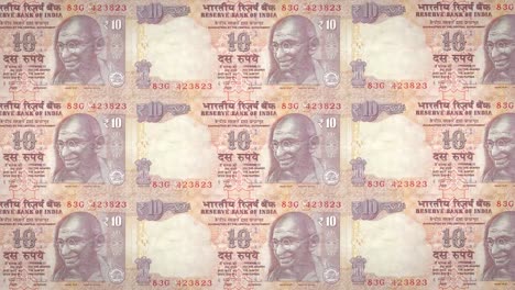 Banknotes-of-ten-indian-rupees-of-India-rolling,-cash-money,-loop