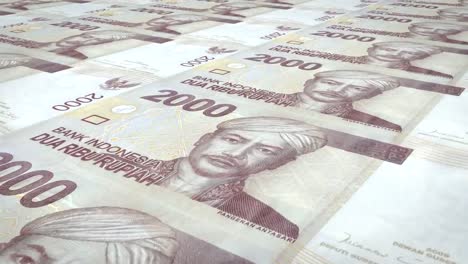 Billetes-de-rupias-indonesias-del-balanceo-2-mil,-dinero-en-efectivo,-lazo