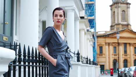 Fashion-Conscious-Young-Woman-Standing-Outdoors-On-City-Street