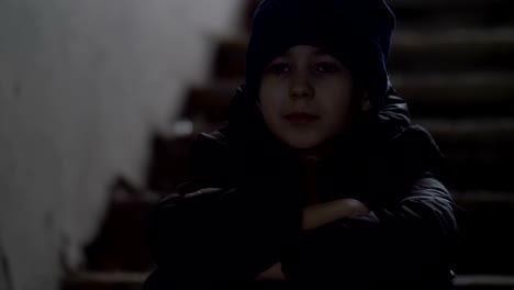 bully-boy-sits-alone-in-an-old-ramshackle-building