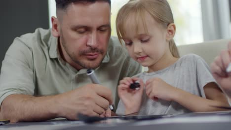 Girl-Drawing-with-Daddy-at-Home