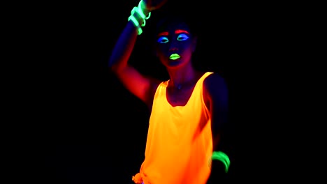 Woman-with-UV-face-paint,-glowing-clothing,-glowing-bracelet-in-front-of-camera,-half-body-shot.-Asian-woman.-.